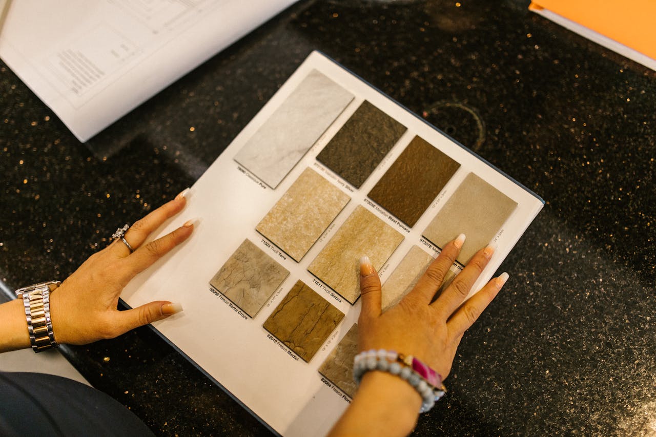 Businesswoman browsing stone samples in office for project evaluation.